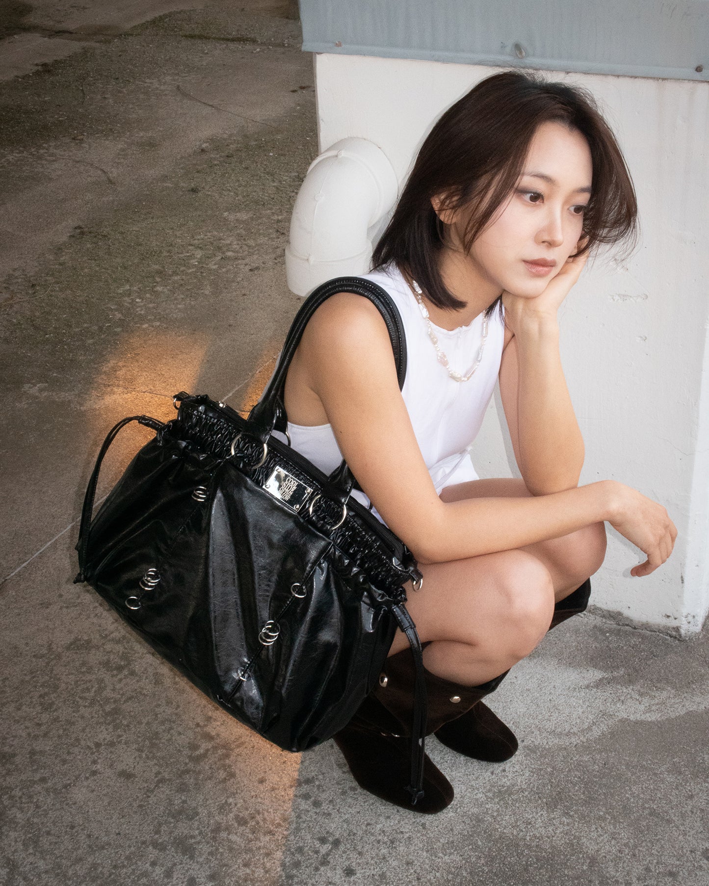 PIERCED BOXER BAG black
