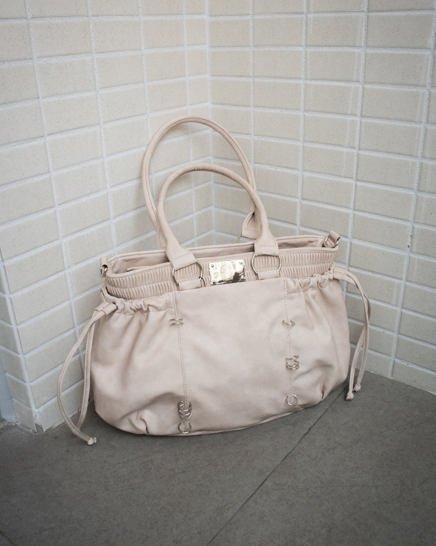PIERCED BOXER BAG sand
