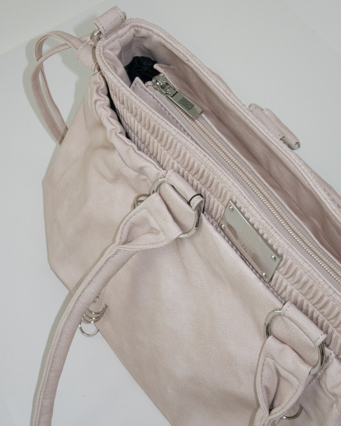 PIERCED BOXER BAG sand