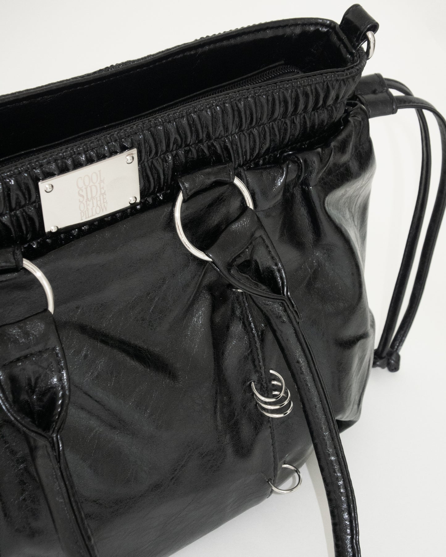 PIERCED BOXER BAG black