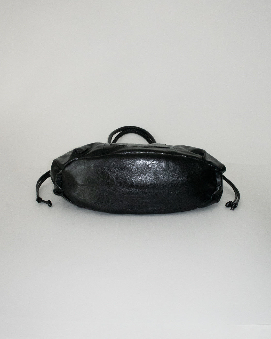 PIERCED BOXER BAG black
