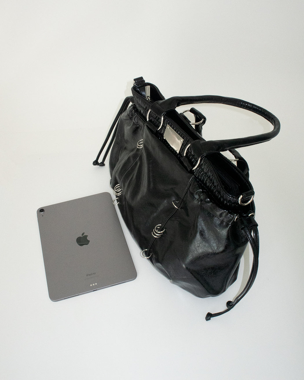 PIERCED BOXER BAG black