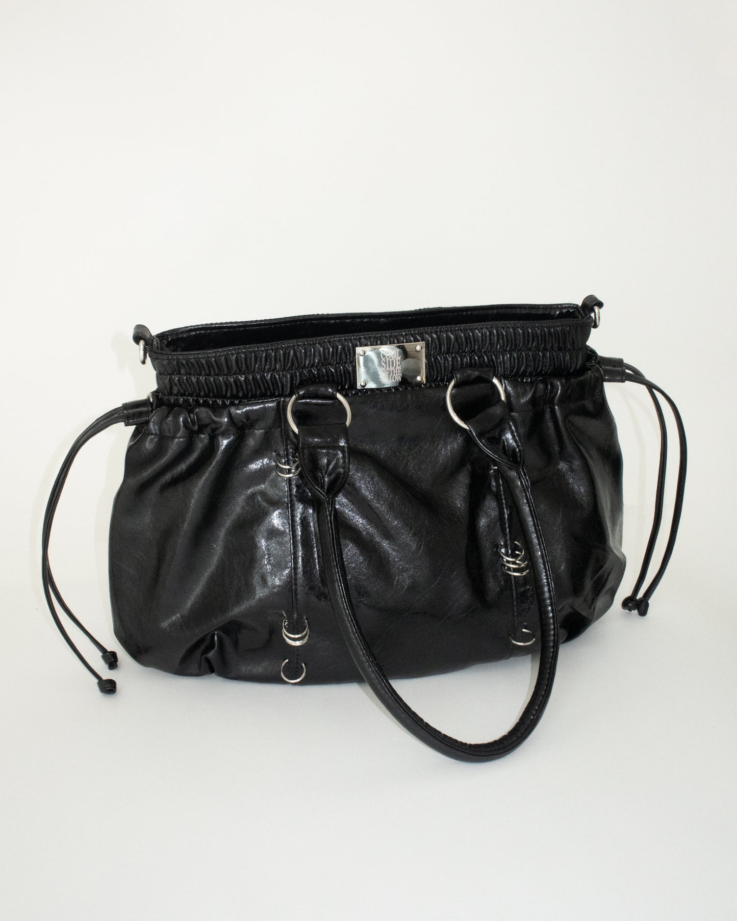 PIERCED BOXER BAG black