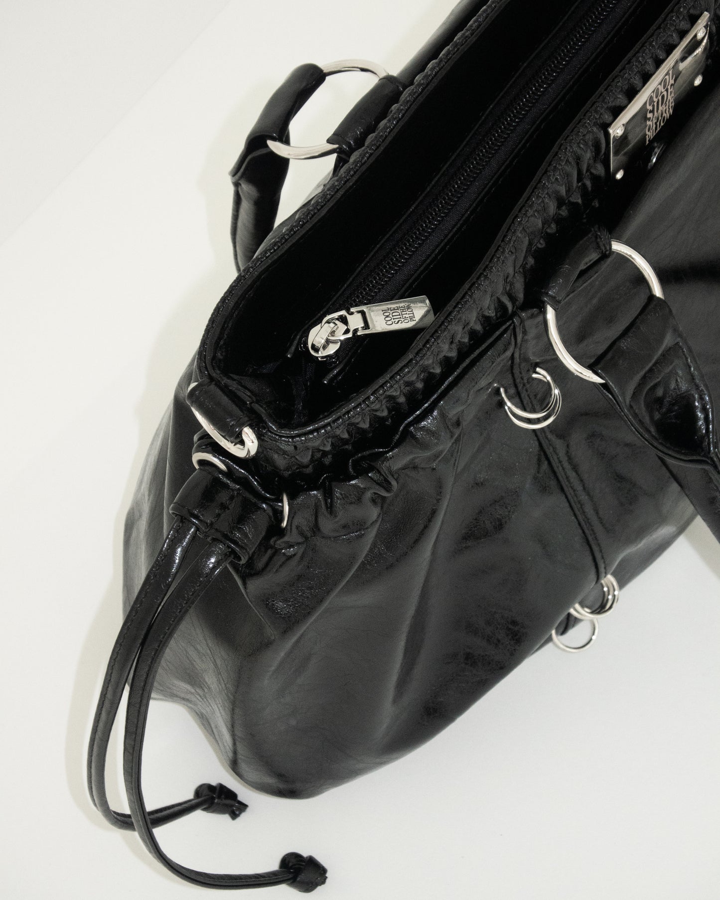 PIERCED BOXER BAG black