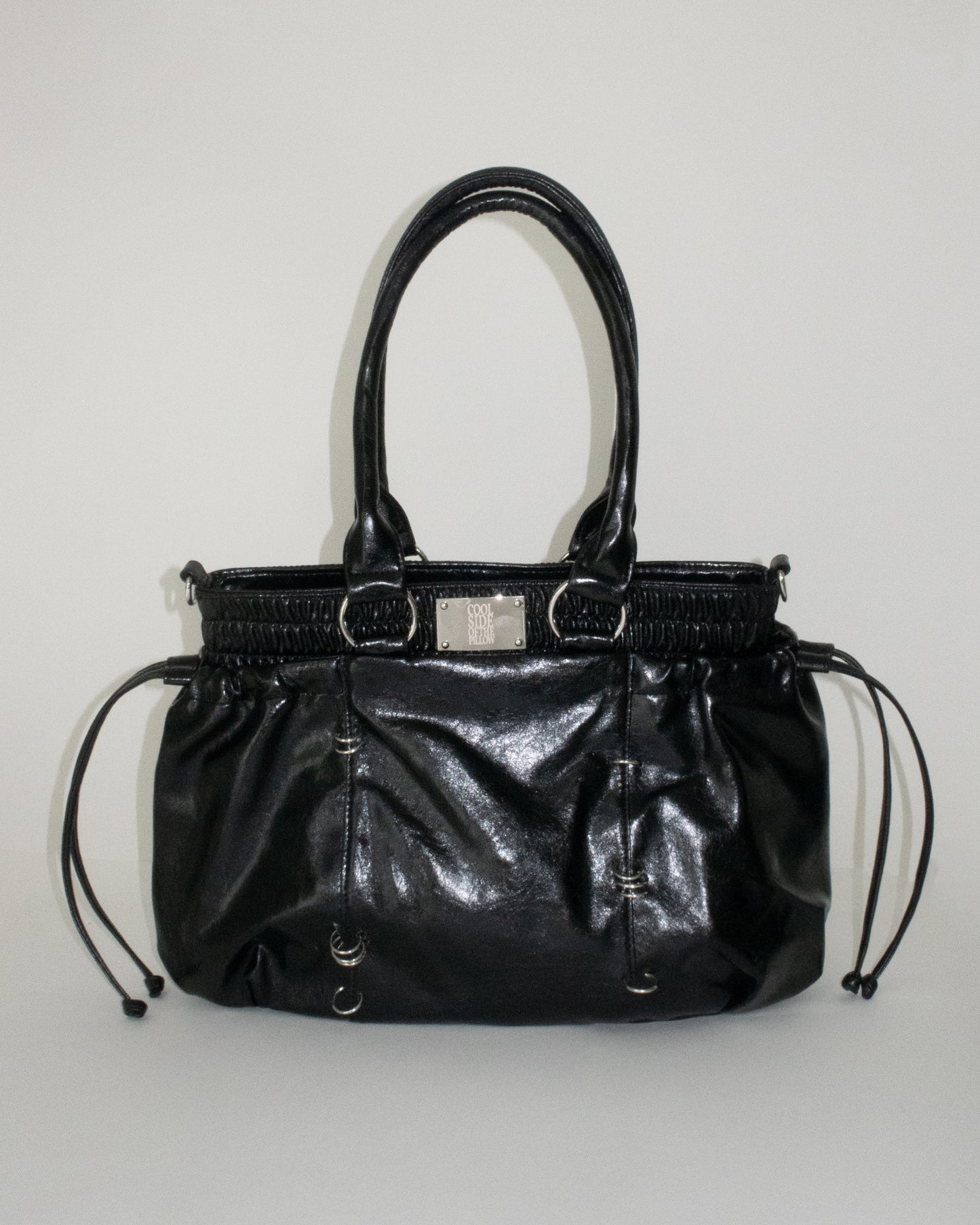 PIERCED BOXER BAG black
