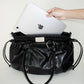 PIERCED BOXER BAG black