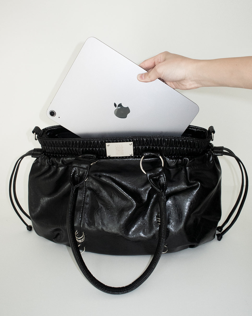 PIERCED BOXER BAG black