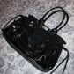 PIERCED BOXER BAG black