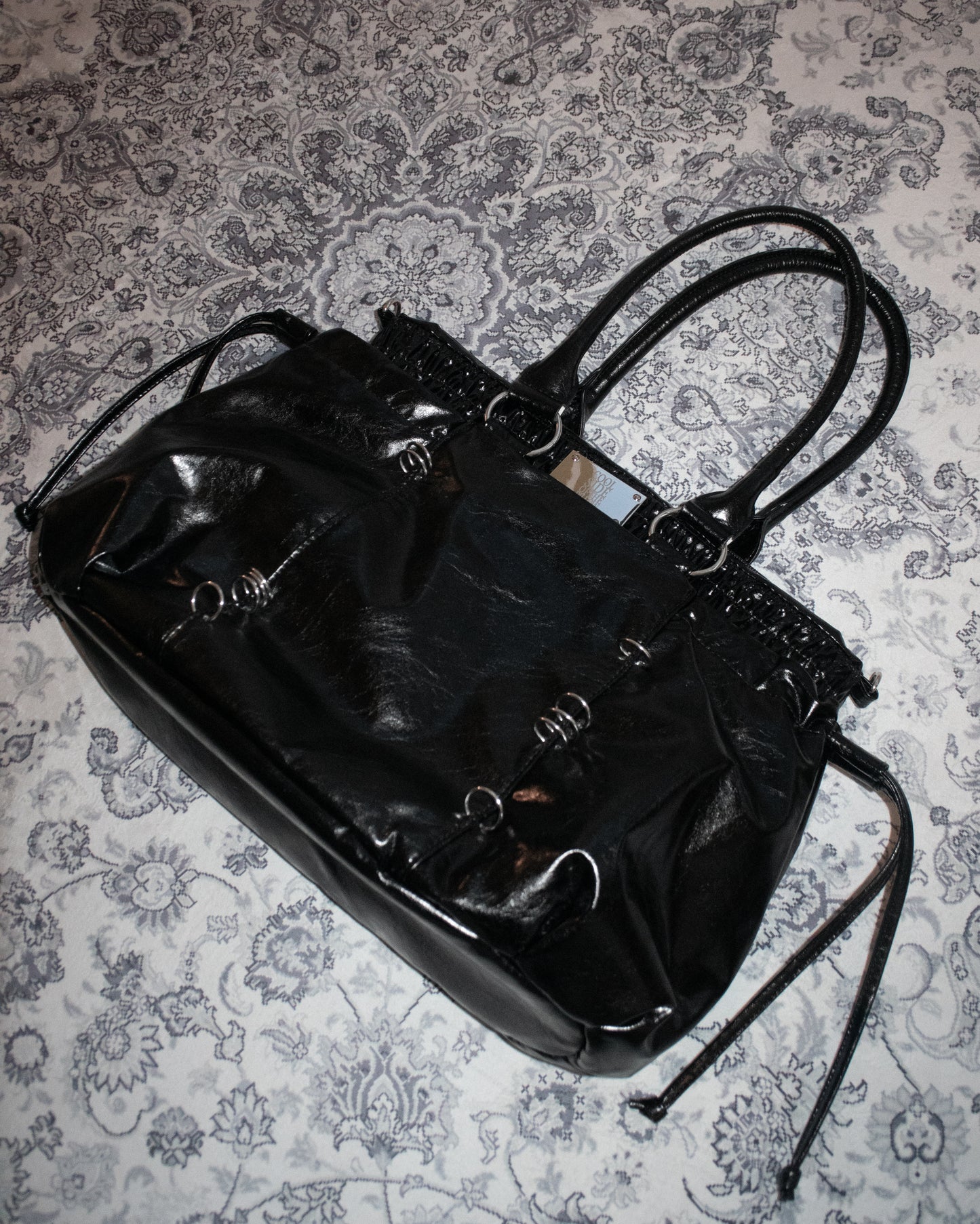 PIERCED BOXER BAG black